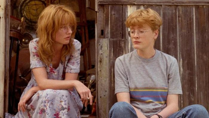 Life Is Sweet: Two adult sisters sit next to each other on a step looking deep in thought