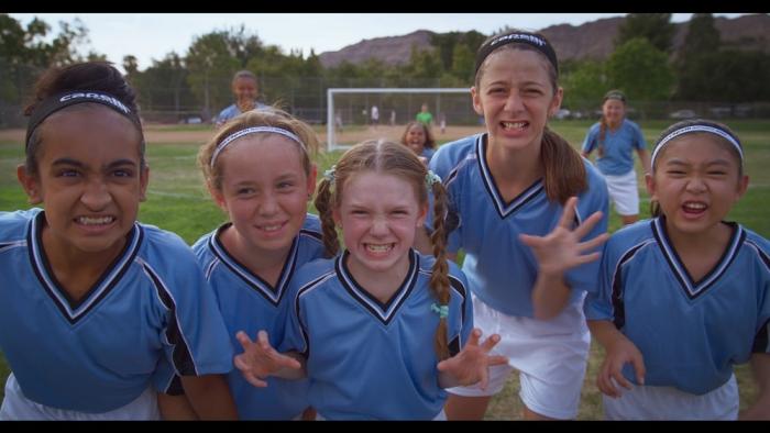 Little Angels movie: Five tween soccer players make clenched-teeth faces at the camera
