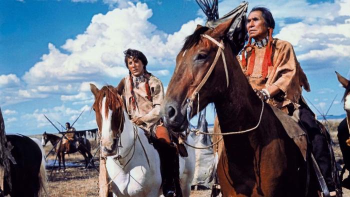 Little Big Man: Chief Dan George and Dustin Hoffman sit atop horses in Native American dress.