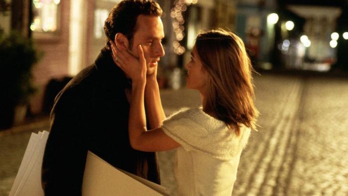 Love, Actually Movie: Keira Knightley holds Andrew Lincoln's face in her hands on the street.
