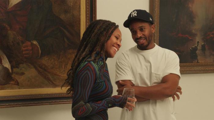 Love, Brooklyn movie: At an art gallery, Andre Holland is saying something to make Nicole Beharie laugh