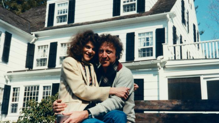 Love, Gilda Movie: Gene Wilder picks up Gilda in front of a white house and they both smile into the camera. 