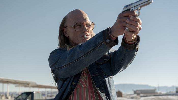 Love Lies Bleeding Movie: Ed Harris points a gun to the right