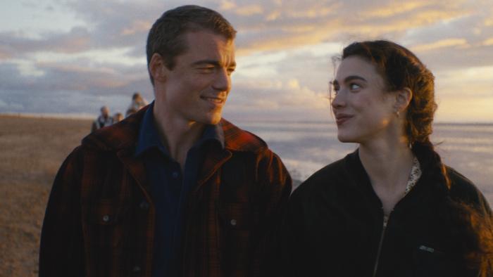 Love of Your Life movie: Gabriel Basso and Margaret Qualley smile lovingly at each other on a beach