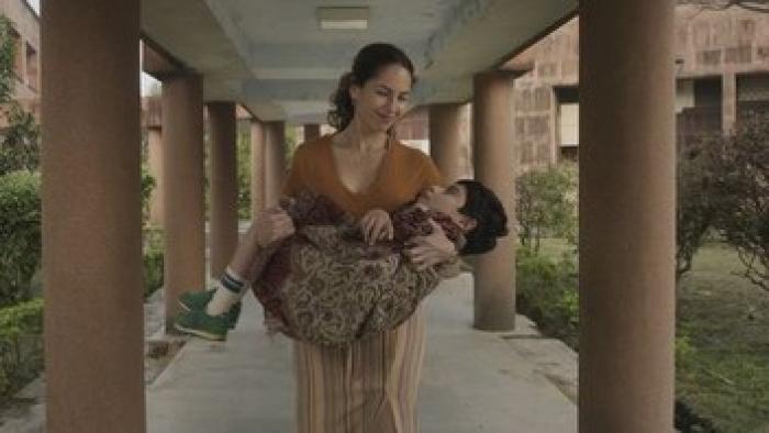 Lucca's World: A mother holds her son.