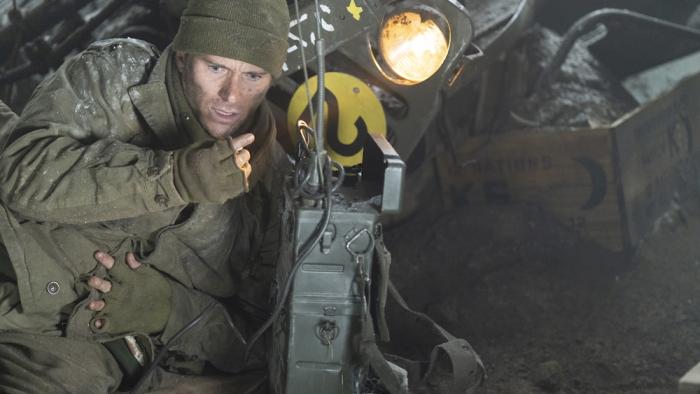 Lucky Strike Movie: Ducking in the dirt and clutching his side, Col. Castle desperately tries to raise help on the radio
