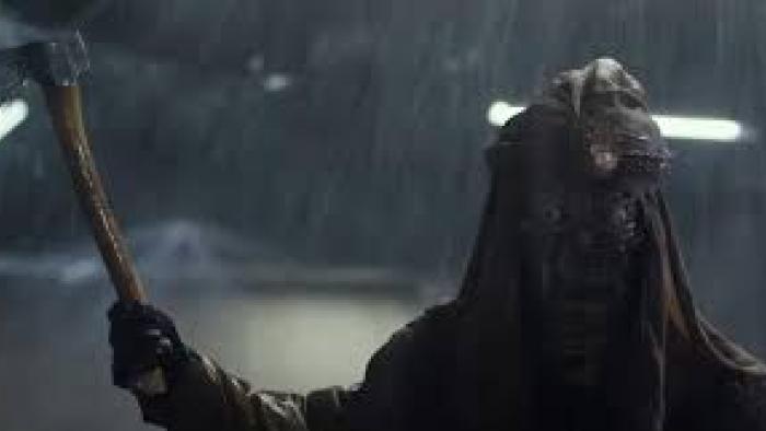 Lumberjack the Monster: Man in shadows with scythe