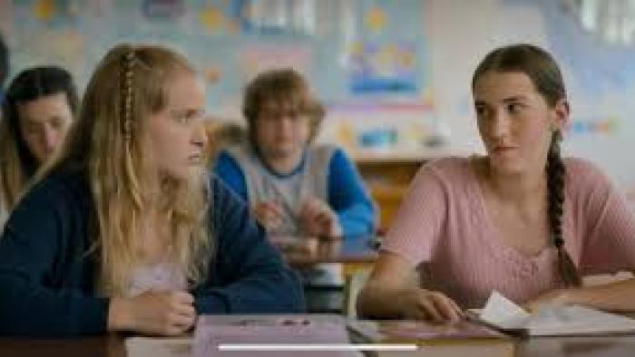 Magnetosphere: Two girls in a classroom give each other dirty looks