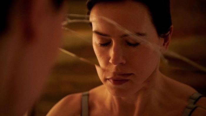 Magpie: Daisy Ridley has her eyes closed, her face reflected in a cracked bathroom mirror