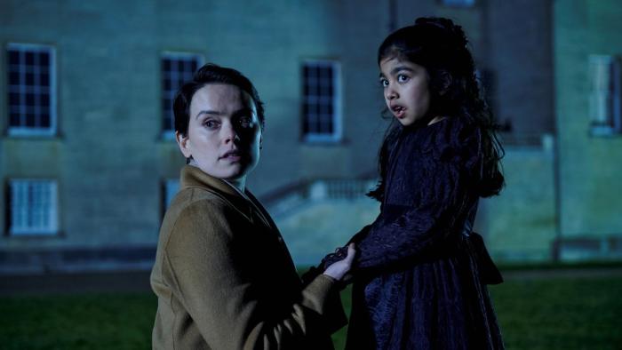 Magpie: Daisy Ridley kneels down to talk to Hiba Ahmed, who plays her daughter, a stately home in the background