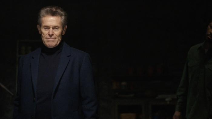 The Man in My Basement Movie: In the dark basement, Anniston looks smug, while Charles looks at him questioningly