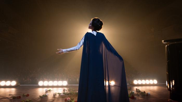 Maria movie: Angelina Jolie sings on stage as Marie Callas in a black cloak and gown