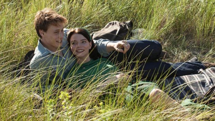 Marrowbone: Couple lying in grass, smiling and pointing, with greenery around
