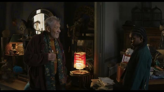 The Christophers: Ian McKellen and Michaela Coel stand opposite each other in a darkened room