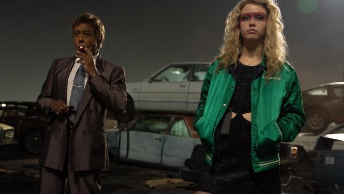 MaXXXine Movie: Agent Teddy Knight (Giancarlo Esposito) stands next to a fierce-looking Maxine at a junkyard