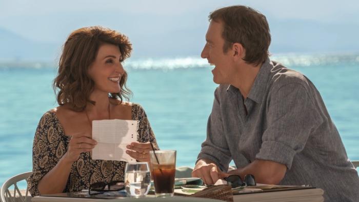My Big Fat Greek Wedding 3 Movie: Toula and Ian smile at each other while sitting outside at a small table
