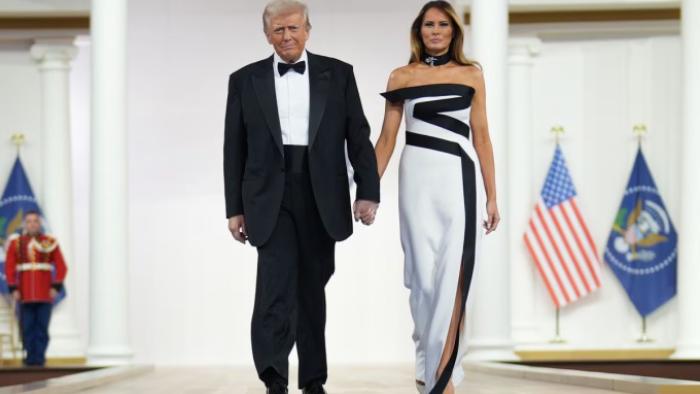 Melania movie: President Donald and Melania Trump walk onstage at a formal event, holding hands