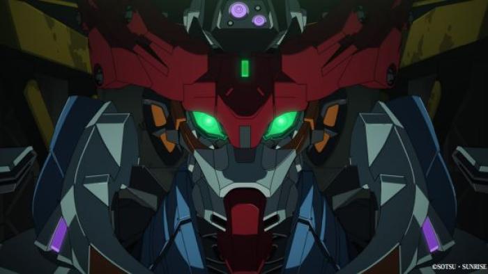 Mobile Suit Gundam GQuuuuuuX: Beginning Movie: A blue, red and grey gundam robot has lit up green eyes