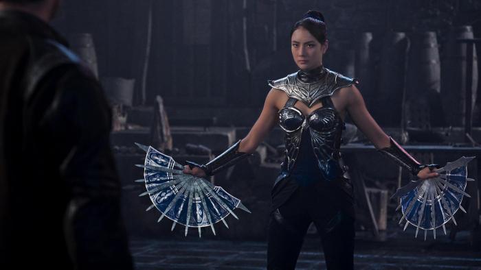 Mortal Kombat II Movie: Princess Kitana (Adeline Rudolph) raises her bladed fans in preparation for a tournament