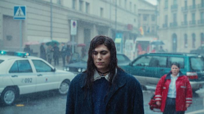 My Dearest Señorita: A woman walks in the rain.