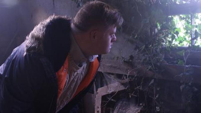 My Feral Heart: Steven Brandon looks out through a window of a structure overgrown with plants