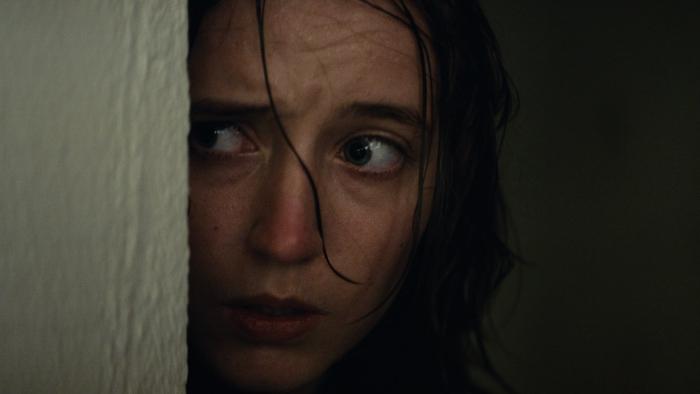 Nightwatch: Demons Are Forever movie: Danish white woman center looks around corner of door frame