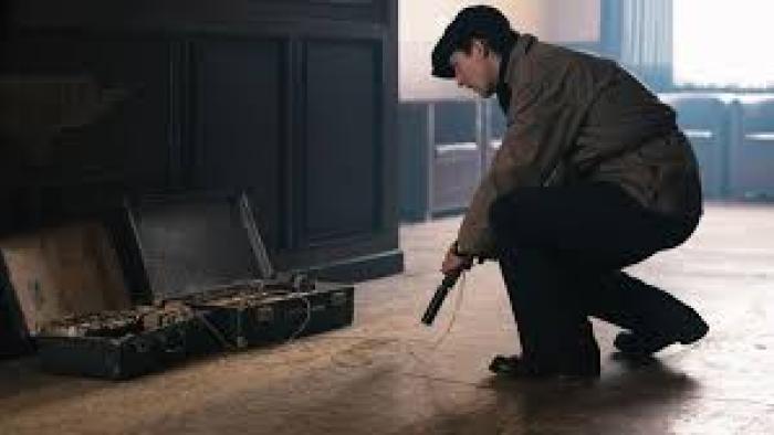 Number 24 movie: Man with gun crouches down