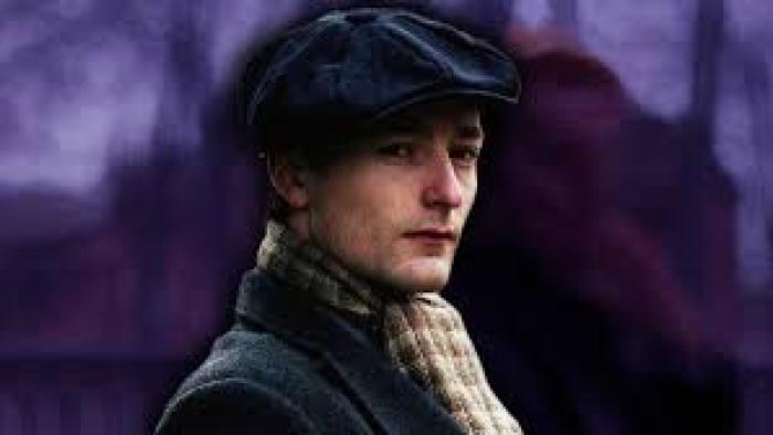 Number 24 movie: White man with hat and scarf against purple sky