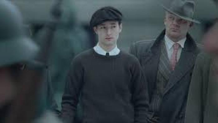 Number 24 movie: White man in hat next to another man 