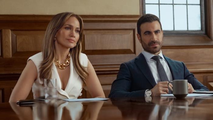 Office Romance: Jennifer Lopez and Brett Goldstein in a disposition.
