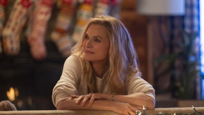 Oh. What. Fun.: Michelle Pfeiffer in front of Christmas stockings.