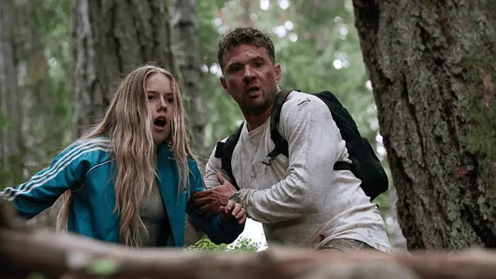 One Mile: Chapter One movie: Amelie Hoeferle gasps as Ryan Phillippe holds her arm