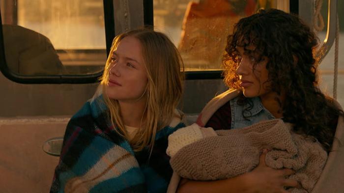 One Mile: Chapter Two movie: Amelie Hoeferle and Sage Linder sit on a boat