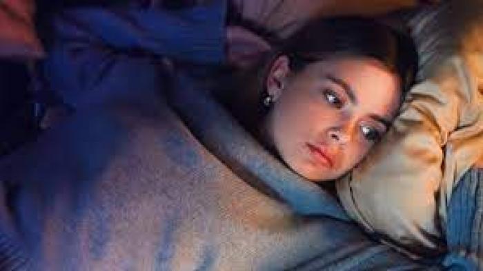 One Night Stand: Indonesian woman in sweater center lies on bed looking wistfully