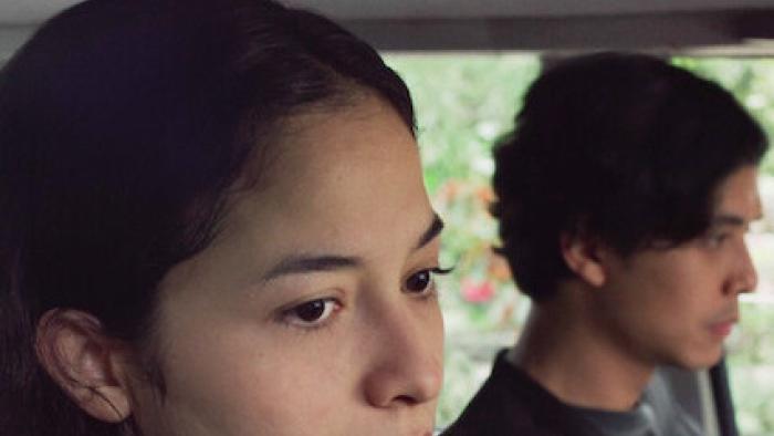 One Night Stand: In car Indonesian woman left looks sad while Indonesian man right also looks sad