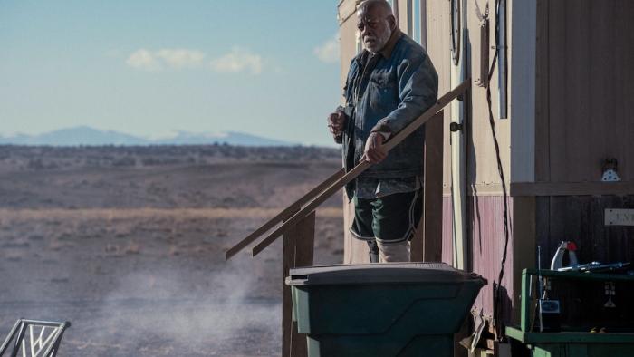 Onslaught Movie: Celeste's neighbor Josiah (Reginald VelJohnson) stands at the top of his steps, looking concerned