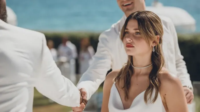 Our Fault: Nicole Wallace dressed in white.