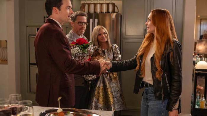 Our Little Secret: Lindsay Lohan shakes hands with Ian Harding.