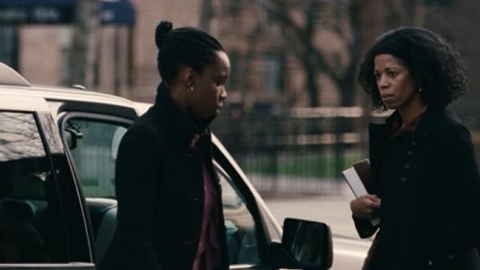 Pariah Movie Poster: Two women in conversation next to a car on a city street.