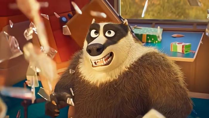 Pets on a train movie: Villain badger Hans looks surprised as glass shatters around him while he's in a train car