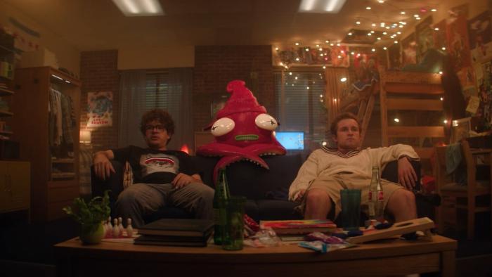 Pizza Movie: Gaten Matarazzo and Sean Giambrone on a couch with a hallucinated character.