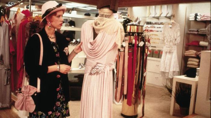 Pretty in Pink Movie: Andie examines an expensive prom dress at a clothing store