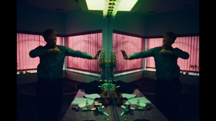 Primetime Movie: Reflected in a dressing-room mirror, Chris Hansen practices a punch to get himself amped up