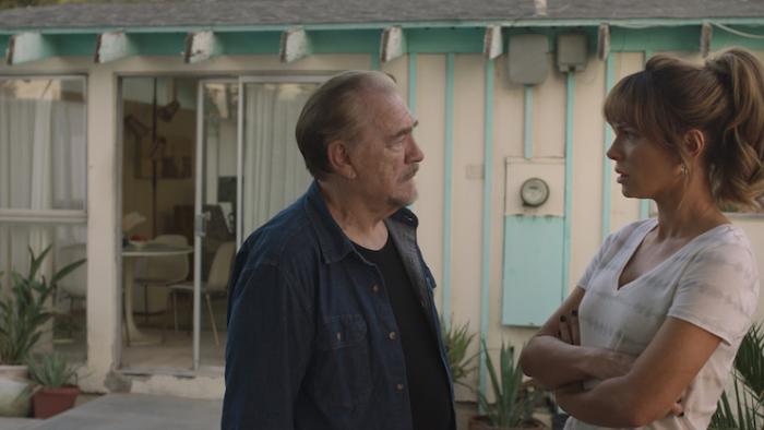 Prisoner's Daughter Movie: Standing in a back yard, Brian Cox talks to Kate Beckinsale