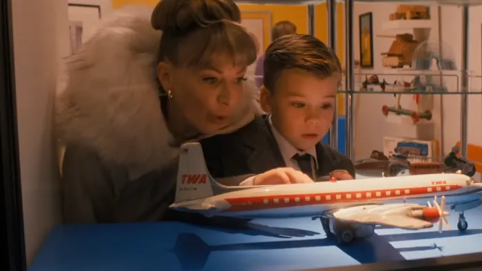 Propeller One-Way Night Coach: Kelly B. Eviston and Clark Showell look at a toy airplane.