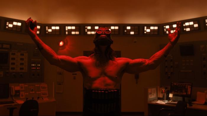 Psycho Killer Movie: In a control room and bathed in red light, the Satanic Slasher spreads his arms wide