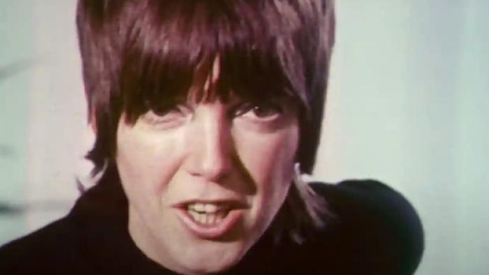 Quant: Close-up of woman with cropped hair and black top