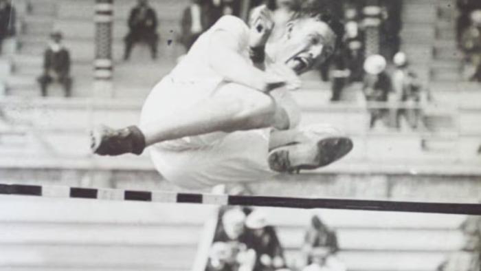 Raising the Bar: The Alma Richards Story movie: Black-and-white photo of the real Alma Richards high jumping over a bar