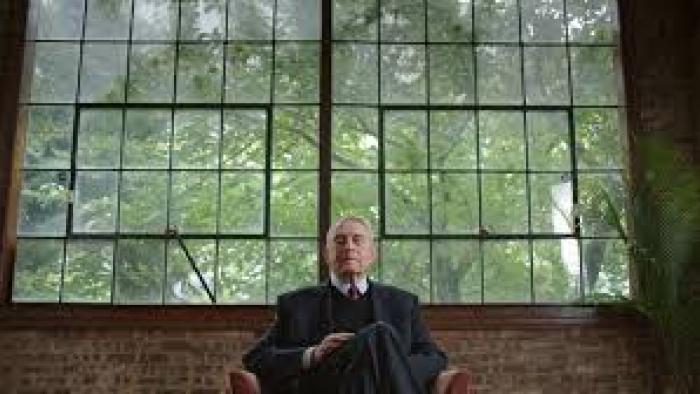 Rather: Dan Rather sits with big window behind him