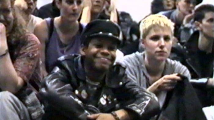 Rebel Dykes: A group of women sit together during a debate.